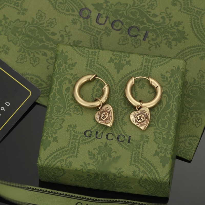 G*u*i earrings